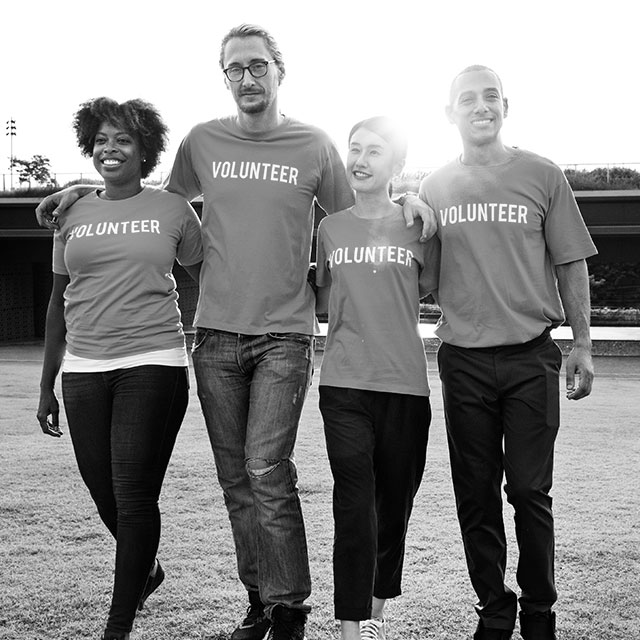 Volunteers walking in field